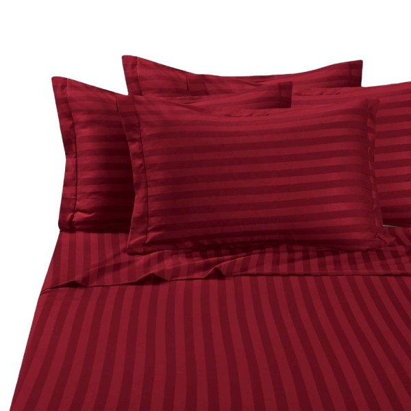 A striped cotton bedspread and sheet set