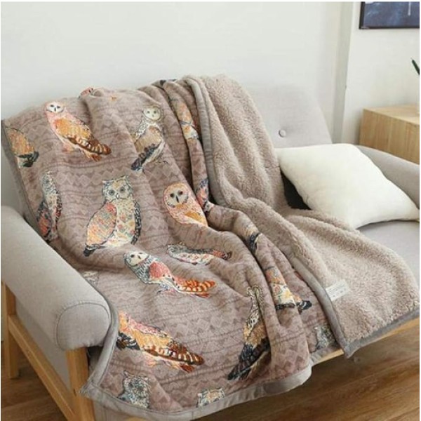 A warm, printed lambswool throw blanket