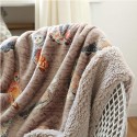 A warm, printed lambswool throw blanket