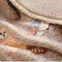 A warm, printed lambswool throw blanket