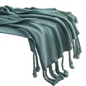 A soft and breathable knitted fringed blanket