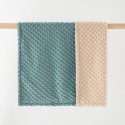 A skin-friendly double-layered quilted blanket with edging